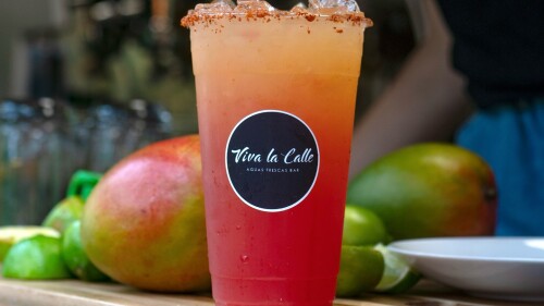 Orange and red augua fresca with a mango rim. 