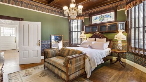 A Victorian-style bedroom. 