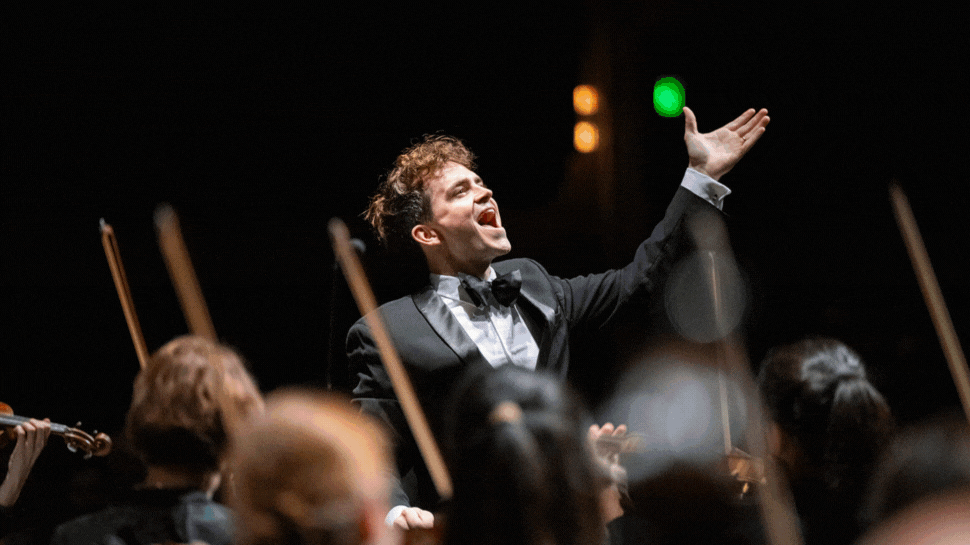 A GIF showing Music Director Lee Mills leading the Greenville Symphony.