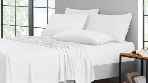 A bed in fresh white sheets. 
