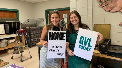 Ana and Christine hold up their final prints 