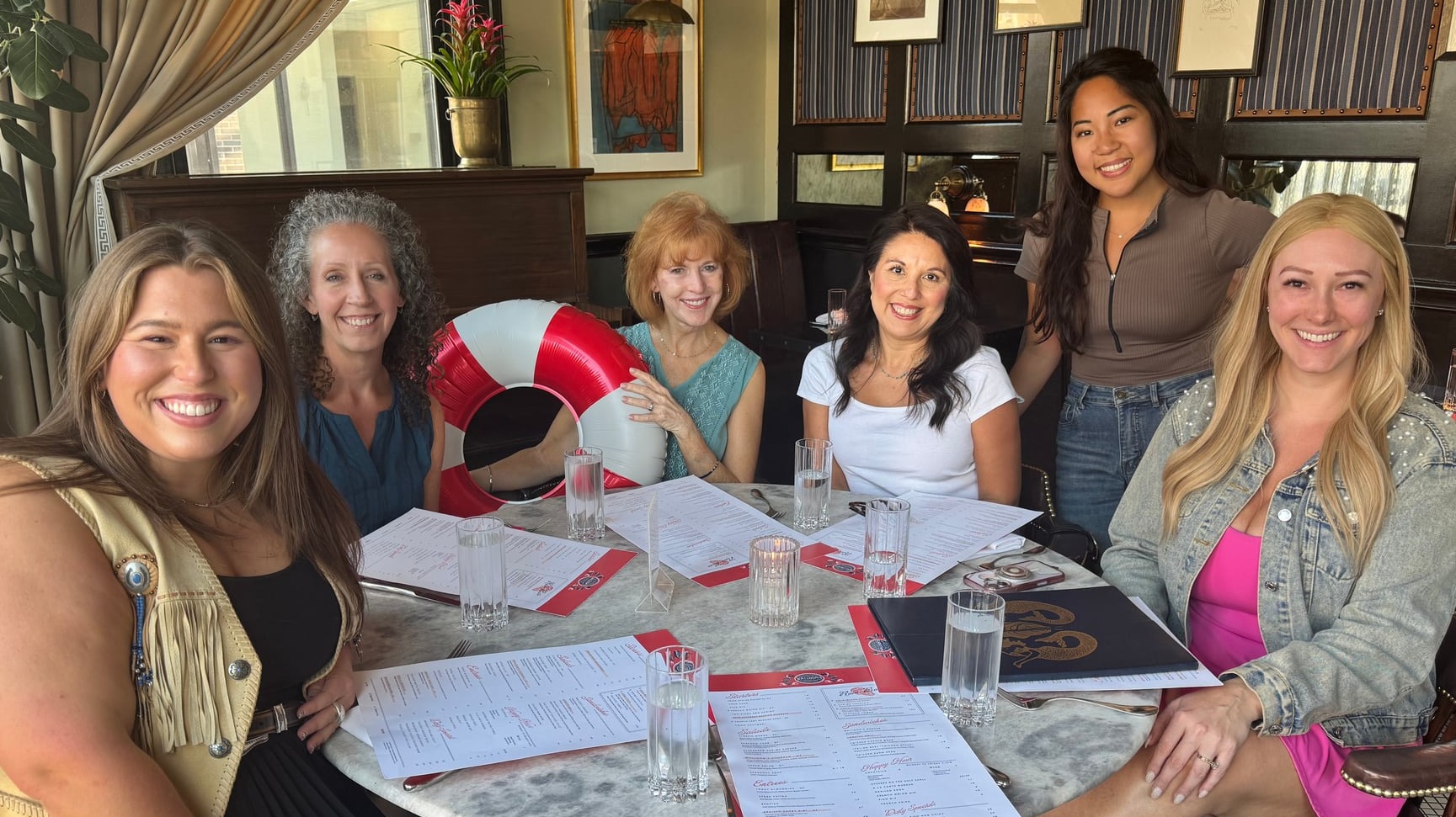 Group of guests at a restaurant with menus on the table