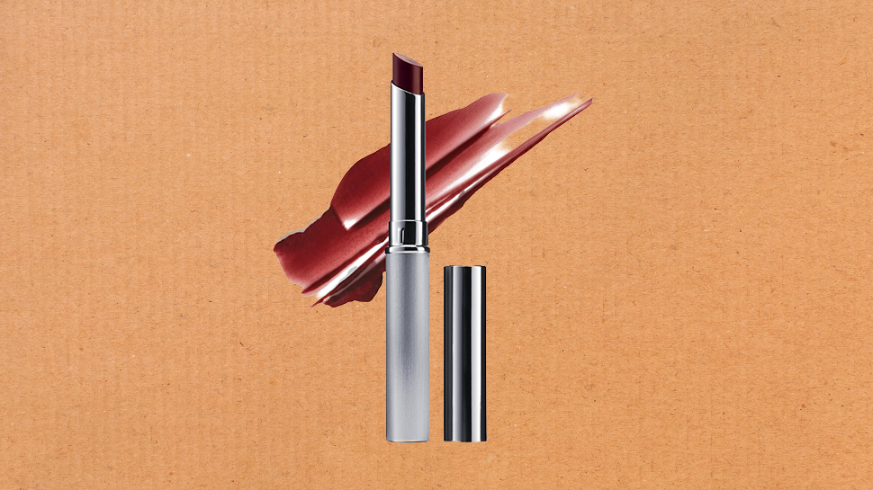 A tube of Black Honey lipstick against a cardboard background.